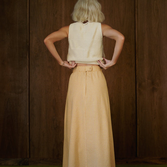 Back view of the Rosemary Skirt in CandyCorn gingham, showing the waistband and sweeping skirt.